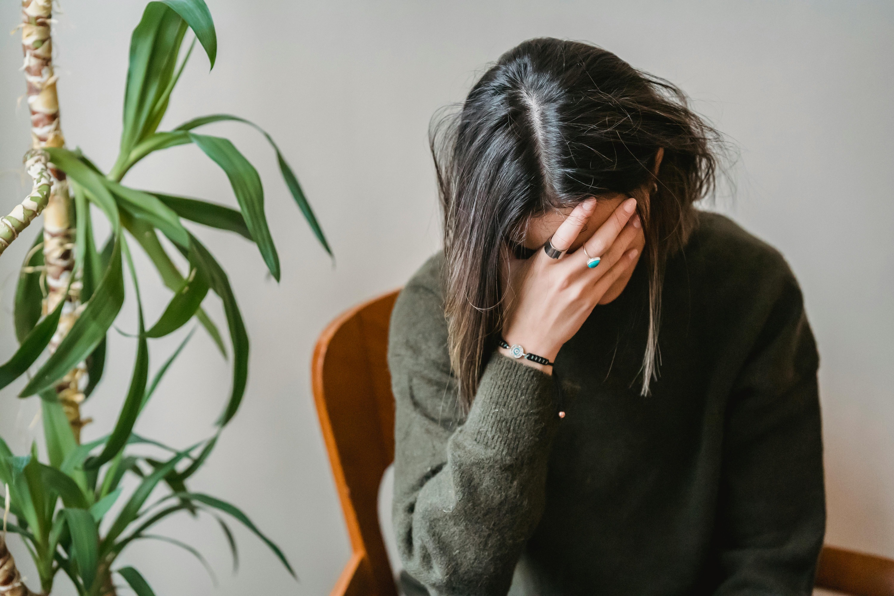 woman holding head